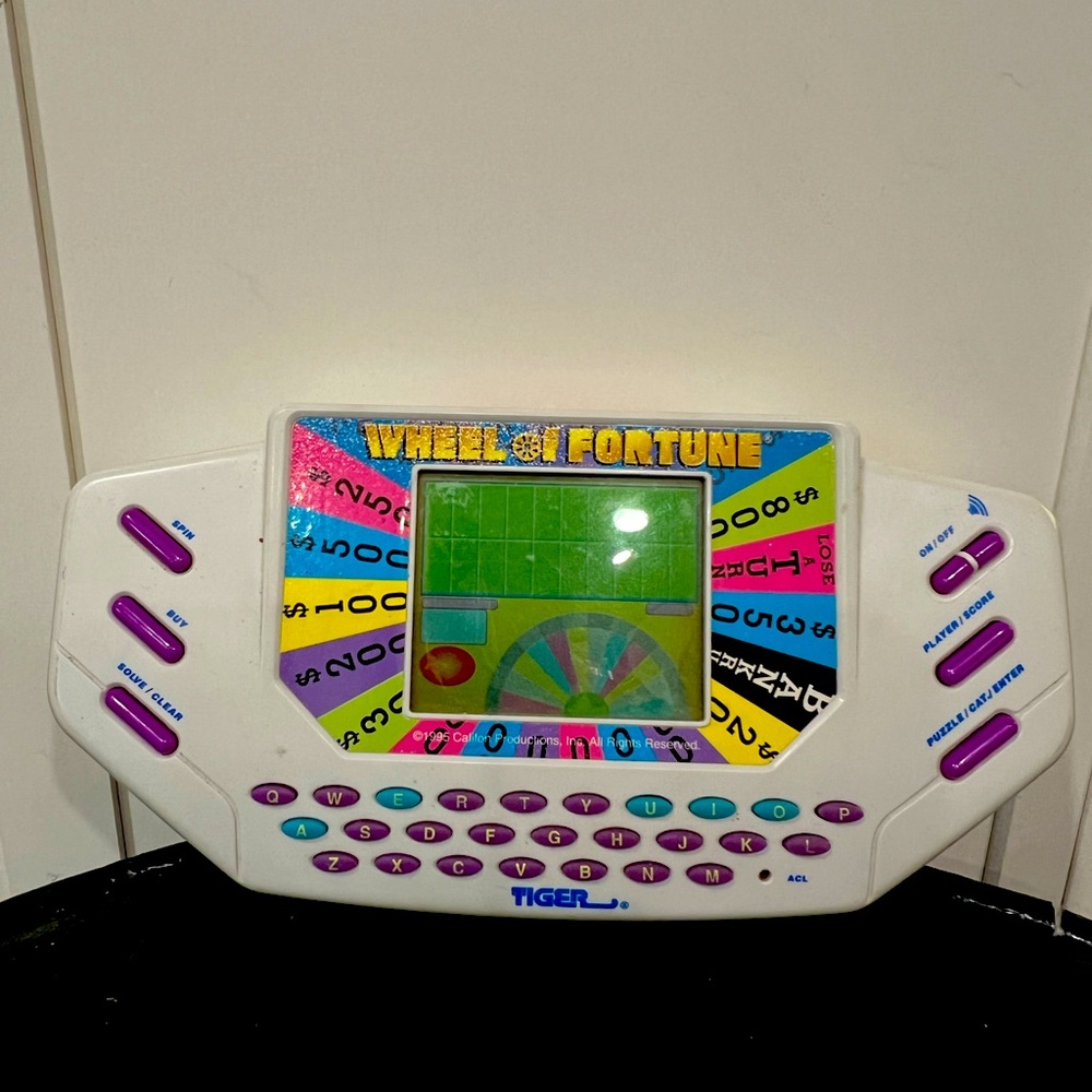 Tiger Electronics Wheel of Fortune Handheld
Video Game - EUC